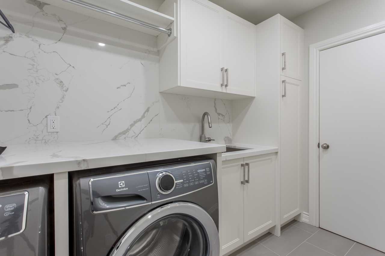 Custom transitional laundry | Luxury design Laundry in Alderbrook Dr ...